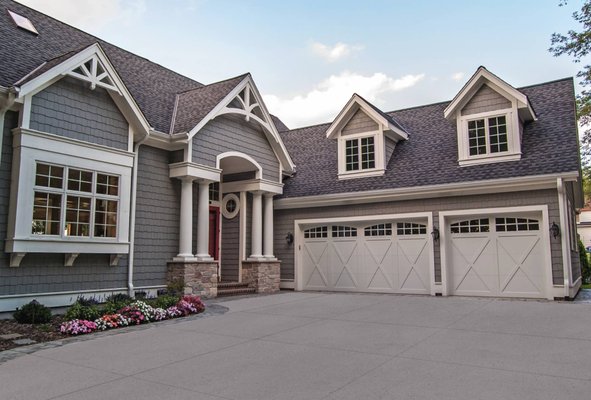OVERLAY CARRIAGE HOUSE GARAGE DOORS - Want to put a bold spin on a classic look? Our expertly crafted overlay carriage garage doors evoke a timeless, old-world aesthetic that complements both modern and contemporary architecture.
Choose from one of three overlays – steel, wood, and fiberglass – to find the design that suits your style. OVERLAY CARRIAGE HOUSE GARAGE DOORS - Want to put a bold spin on a classic look? Our expertly crafted overlay carriage garage doors evoke a timeless, old-world aesthetic that complements both modern and contemporary architecture.
Choose from one of three overlays – steel, wood, and fiberglass – to find the design that suits your style.