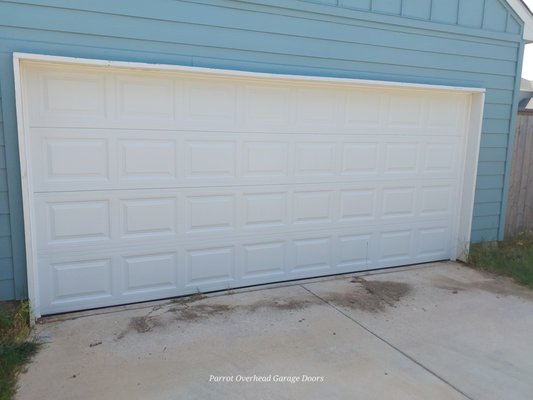 Custom Highlift Garage Door - This install was a custom design high lift to prevent the pass through door from hitting the garage door tracks when being used. the door shown is a 16x7 with vinyl back insulation. The door is a manual lift with an inside slide lock. Custom Highlift Garage Door - This install was a custom design high lift to prevent the pass through door from hitting the garage door tracks when being used. the door shown is a 16x7 with vinyl back insulation. The door is a manual lift with an inside slide lock.