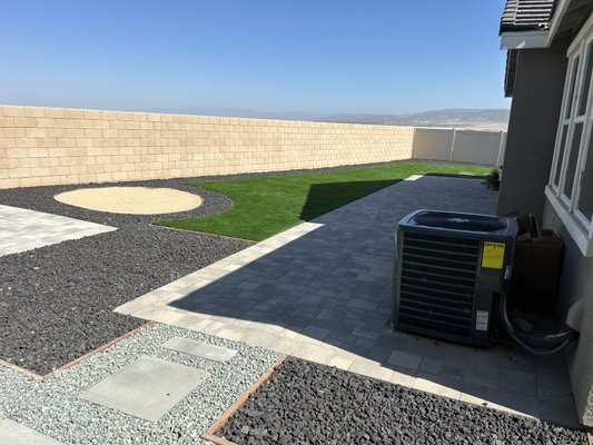 Westmont Project - This yard was pure desert and was transformed with turf, rock and stepping stones. Westmont Project - This yard was pure desert and was transformed with turf, rock and stepping stones.