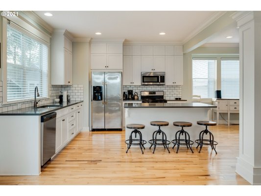 NE Kitchen Remodel - This model was done on a home in NE Portland and included tile work in the kitchen and bathrooms, new countertops, new hardwood floor on main and carpet on second and third floors and fireplace refaced with a beautiful glass mosaic design.

Licensed-Bonded-Insured