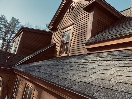 Candia Exterior Trim & Clapboard Job - House - House - This remodel job was redone with all new red cedar clapboard and rough cut lumber which was all pre-stained on the ground before hand.