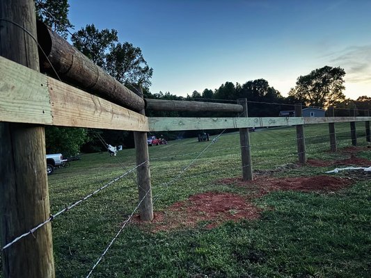 Horse fence installation in Shelby NC - Horse fence installed in Shelby NC. The project started by installing a white vinyl 3 rails fence. The owner of the ranch decided that we could build a new fence for his horses.