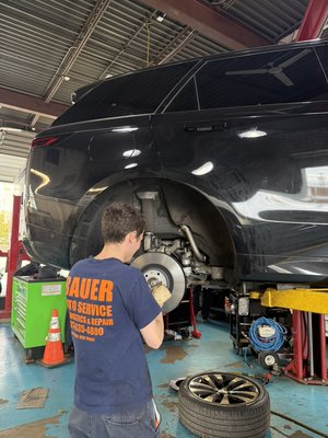 Brake Repair - Vehicle brakes are critical safety components. At Bauer Automotive, not only can we inspect your brakes, we can replace them with quality aftermarket or OEM parts. We can also deal with leaking brake lines, caliper replacements, and other brake services, including brake fluid flushes. At Bauer Automotive, we always replace brake pads and rotors at the same time to ensure optimal performance and safety. Check out some photos of our mechanics performing brake work.