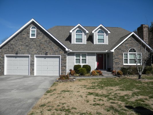 Alcoa, Tennessee Remodel - Retired Teacher from Alcoa, TN wanted to remodel instead of selling her home and purchasing another. We stepped in and it turned out amazing. New Premium Vinyl Replacement Windows highlighted the new Stone work and Vinyl Siding, and Gutters. Alcoa, Tennessee Remodel - Retired Teacher from Alcoa, TN wanted to remodel instead of selling her home and purchasing another. We stepped in and it turned out amazing. New Premium Vinyl Replacement Windows highlighted the new Stone work and Vinyl Siding, and Gutters.
