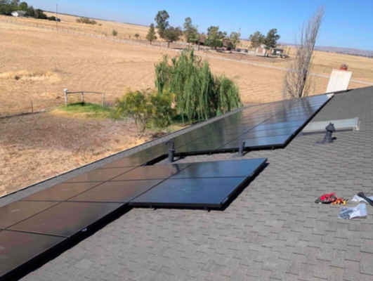 Roof+Solar+Gutters  = A Very Happy Customer in Chico - Sometimes, in roofing, we get to be Hero's, which feels great. This was one of those cases and it was an honor to work for this family. They suffered many leaks for multiple seasons. Upon water testing we found the existing roof tile was improperly installed, as the roofer failed to meet the minimal overlap of the tile, allowing water to seep in randomly through the lap of the tile. A horrible diagnosis for the customer, but they were relieved to at least finally have a definitive diagnosis.

We proceeded with a full tear off and re-roof with new Owens Corning Presidential shingles and new 5" seamless gutters. The final result was a total facelift on the house, a beautiful transformation.

The all black, AC Sunpower solar system looks great on the dark shingle and set the family on the road to freedom from PGE.

As it is with all our customers, we built a lasting relationship with the family and enjoyed their hospitality while we were on their property. Thank you!