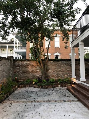 Pelican Coast Courtyard Renovation - DeTonti Square - Courtyards and landscape lighting are a growing niche for us, and this courtyard challenge has been one of our favorite projects. Pelican Coast asked for a renovation of a historic courtyard, preserving a mature mulberry tree and adding a water feature as well. We mixed oyster shells with concrete for a tabby surface both handsome and fitting for the organization's environmental mission. Irrigation will ensure plant health, and landscape lighting truly makes the space. We even secured a bronze pelican statue for the fountain - to create not just a beautiful but remarkable space. Pelican Coast Courtyard Renovation - DeTonti Square - Courtyards and landscape lighting are a growing niche for us, and this courtyard challenge has been one of our favorite projects. Pelican Coast asked for a renovation of a historic courtyard, preserving a mature mulberry tree and adding a water feature as well. We mixed oyster shells with concrete for a tabby surface both handsome and fitting for the organization's environmental mission. Irrigation will ensure plant health, and landscape lighting truly makes the space. We even secured a bronze pelican statue for the fountain - to create not just a beautiful but remarkable space.