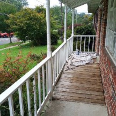 front porch repair on handrails - had to replace the handrails and then paint everything
