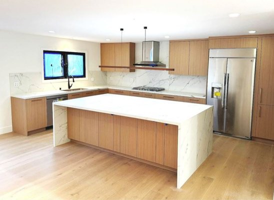 Kitchen & Living Room Remodel 2024 - We recently completed a stunning full-scale home renovation that completely redefined the layout and functionality of the living space. At the heart of this transformation is a brand-new custom kitchen, thoughtfully designed for both style and practicality. Outfitted with high-end appliances, sleek cabinetry, and premium finishes, the kitchen now serves as a modern, open hub for daily living and entertaining.

To create a more open and connected environment, we removed a load-bearing wall to combine two separate living rooms into one expansive grand room. This major structural update not only increased the usable square footage but also dramatically enhanced the home’s flow, natural light, and sense of spaciousness.

To further maximize light and views, we removed two small existing windows and installed three new, larger windows. This change brings in significantly more daylight, highlights the outdoor surroundings, and adds an airy, inviting atmosphere to the main living areas.

This renovation is a perfect example of how strategic design and structural enhancements can completely elevate a home’s comfort, beauty, and long-term value.