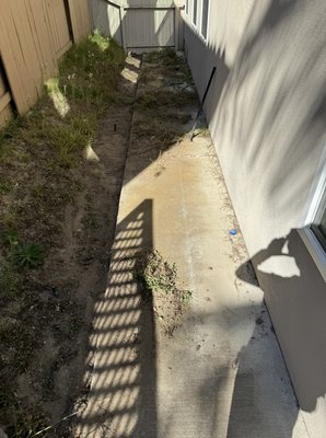 Backyard Transformation. - Behold the stunning backyard transformation! We've revamped your space with pavers, a retaining wall, artificial turf, and a drainage system, crafting a beautiful, low-maintenance oasis. Experience the perfect blend of functionality and beauty!
