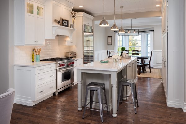 Kitchen Design Remodel Modern Farmhouse - Modern Farmhouse kitchen creates a casual elegance that the entire family can enjoy. Eat-in kitchen - mid-sized transitional galley medium tone wood floor and brown floor eat-in kitchen idea in Boston with a farmhouse sink, shaker cabinets, white cabinets, quartz countertops, white backsplash, ceramic backsplash, stainless steel appliances, and no island Kitchen Design Remodel Modern Farmhouse - Modern Farmhouse kitchen creates a casual elegance that the entire family can enjoy. Eat-in kitchen - mid-sized transitional galley medium tone wood floor and brown floor eat-in kitchen idea in Boston with a farmhouse sink, shaker cabinets, white cabinets, quartz countertops, white backsplash, ceramic backsplash, stainless steel appliances, and no island