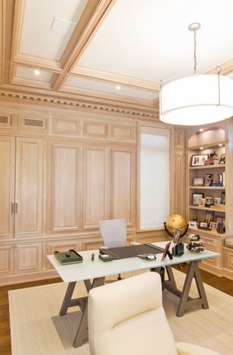 Light oak stained modern library. - With constant sun exposure throughout the day, our client wanted to stain the interior in a light tone to harness the ample natural light entering the interior. Focusing most of the detail of the interior's design around the raised moldings of the surrounding cabinetry. Light oak stained modern library. - With constant sun exposure throughout the day, our client wanted to stain the interior in a light tone to harness the ample natural light entering the interior. Focusing most of the detail of the interior's design around the raised moldings of the surrounding cabinetry.