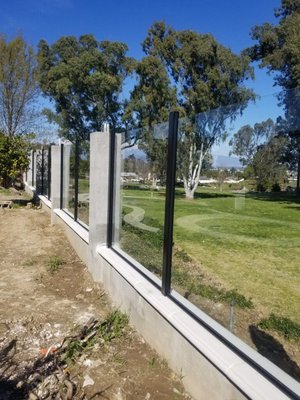 Glass Fences-ONLY NEW INSTALLATIONS - ONLY NEW INSTALLATIONS, NO REPAIRS Irvine Fence Inc. uses the highest quality tempered glass for all its clear-view glass fencing installations.
Our Glass wall system provides the following advantages:
* Virtually Maintenance Free
* Unmatched Strength
* Won’t Rust or Rot
* Engineered to meet or exceed all Building Codes
* & many other Benefits! ----> Contact us today to discuss your project! Glass Fences-ONLY NEW INSTALLATIONS - ONLY NEW INSTALLATIONS, NO REPAIRS Irvine Fence Inc. uses the highest quality tempered glass for all its clear-view glass fencing installations.
Our Glass wall system provides the following advantages:
* Virtually Maintenance Free
* Unmatched Strength
* Won’t Rust or Rot
* Engineered to meet or exceed all Building Codes
* & many other Benefits! ----> Contact us today to discuss your project!
