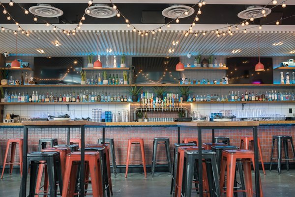 Navy Yard, DC - Trendy Bar Install.  Audio, Video, Control, CCTV, Low-Voltage Cabling and Network - Please see pictures of Navy Yard's trendiest bar, where One Source Systems has seamlessly designed, installed, and maintained an unparalleled audio-visual experience. Our expertise in high-quality audio video, automated controls, low-voltage wiring, a robust network, and CCTV shines in this dynamic and vibrant venue.

As the trusted provider behind this cutting-edge project, One Source Systems was entrusted to create a unique identity and vibrant atmosphere for this popular bar and restaurant. Our meticulous design and skillful installation have elevated the patron's experience to a whole new level, integrating state-of-the-art technology and innovative design seamlessly.

Immerse yourself in crystal-clear audio that fills the space without overpowering conversations. With carefully positioned video displays, you won't miss a moment of the big game or the latest music videos, no matter where you're seated.

Our automated controls put the power in the hands of the staff, allowing them to effortlessly adjust lighting, sound, and visuals with a simple touch. This creates the perfect atmosphere for any event or time of day, ensuring an unforgettable experience for all. Meanwhile, our robust network, known as the heart of the system, guarantees seamless operation and keeps everything running smoothly and efficiently.

Safety is of utmost importance, which is why we strategically placed high-definition CCTV cameras throughout the venue. With our intuitive and easy-to-use platform, patrons and staff can enjoy a secure environment without sacrificing convenience.

At One Source Systems, we take immense pride in enhancing the overall bar experience through exceptional design and installation. Beyond offering great drinks and food, this bar is an extraordinary fusion of tradition and innovation, providing a one-of-a-kind entertainment zone for our valued customers.

Come and experience the epitome of audio-visual excellence at this must-visit destination in the Navy Yard neighborhood. Celebrate every visit in an environment where tradition meets innovation. Trust One Source Systems to deliver unrivaled expertise and create unforgettable moments for you and your guests.

Step into the world of elevated entertainment with One Source Systems. Visit [Bar Name] and discover the difference we bring to every project we undertake.