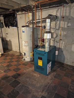 Boiler & water heater replacement and move - Our customer in upper NW needed a new boiler, but modern codes meant that her existing exhaust piping was too long. They wanted the simplicity of a cast iron boiler and simple gas water heater, so high end tankless units that exhaust directly outside were not an option. We needed to move both appliances to be much closer to the masonry chimney to use it for the exhaust- we also had to drop a metal liner down the chimney to meet modern code. It was a bit of work, but now our customer has reliable heat and hot water for many years to come! -Tim Whistler Boiler & water heater replacement and move - Our customer in upper NW needed a new boiler, but modern codes meant that her existing exhaust piping was too long. They wanted the simplicity of a cast iron boiler and simple gas water heater, so high end tankless units that exhaust directly outside were not an option. We needed to move both appliances to be much closer to the masonry chimney to use it for the exhaust- we also had to drop a metal liner down the chimney to meet modern code. It was a bit of work, but now our customer has reliable heat and hot water for many years to come! -Tim Whistler