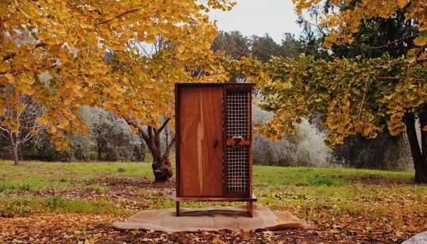 Walnut and Cherry Liquor Cabinet - This piece is a custom commissioned Liquor Cabinet made out of locally sourced materials. Soft-close hardware, woven drawer faces, interior lighting and ample storage to showcase the clients collection.