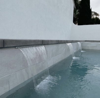 New Pool/ Spa Combo - This new pool and spa was created in Irvine & continues to be one of our many favorites with the gorgeous waterfall and spa spillover details.