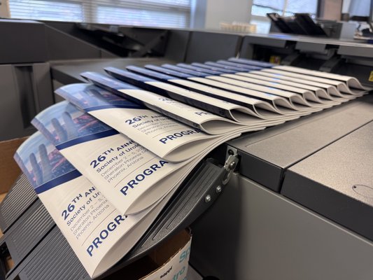 Conference Program Book Printing - When a national conference needed thousands of full-color program booklets produced on a tight deadline, The Printing Factory stepped in to deliver. With final files arriving on a compressed timeline, our team moved quickly through prepress, production, and finishing to ensure every booklet met our high-quality standards. We coordinated packaging and nationwide shipping to guarantee on-time delivery ahead of the conference kickoff. Conference Program Book Printing - When a national conference needed thousands of full-color program booklets produced on a tight deadline, The Printing Factory stepped in to deliver. With final files arriving on a compressed timeline, our team moved quickly through prepress, production, and finishing to ensure every booklet met our high-quality standards. We coordinated packaging and nationwide shipping to guarantee on-time delivery ahead of the conference kickoff.