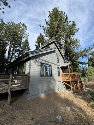 South Lake Tahoe James Hardie siding/ windows installation - Transforming homes in South Lake Tahoe  is what we do best—and this project is a perfect example. We elevated this property with premium James Hardie HZ5 lap siding, shingles, and board-and-batten details, giving it a stunning modern look while dramatically boosting fire resistance—a must for mountain living.

To enhance outdoor living and long-term value, we installed durable Trex decking in both the front and back, creating beautiful, low-maintenance spaces built to withstand the elements. We completed the upgrade with brand-new Andersen windows, delivering improved energy efficiency, comfort, and curb appeal.

The result? A home that not only looks incredible but is safer, stronger, and worth more. If you’re ready to increase your property’s value and protection with a premium exterior remodel, we’re the team to call.