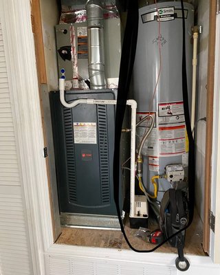 Furnace Closet Repair, New HVAC & Water Heater Installation - This house had a terribly looking mechanical closet, extensive damage all over the Sheetrock and huge holes in it, old water heater and a ugly inefficient downflow furnace, We removed everything and redid the furnace closet with a base for upflow and bottom return air. We installed a water heater and a new HVAC system. Furnace Closet Repair, New HVAC & Water Heater Installation - This house had a terribly looking mechanical closet, extensive damage all over the Sheetrock and huge holes in it, old water heater and a ugly inefficient downflow furnace, We removed everything and redid the furnace closet with a base for upflow and bottom return air. We installed a water heater and a new HVAC system.
