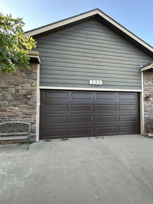 Garage Door Replacement - Mother Nature doesn't hold back, and a recent severe storm left this home's old garage door completely totaled.
We love helping homeowners bounce back stronger.
We replaced the storm-damaged unit with a premium, reinforced C.H.I. steel sectional door. The deep chocolate finish looks incredibly sharp against the stone accents, and the upgraded, durable construction brings back the peace of mind these homeowners deserve. Garage Door Replacement - Mother Nature doesn't hold back, and a recent severe storm left this home's old garage door completely totaled.
We love helping homeowners bounce back stronger.
We replaced the storm-damaged unit with a premium, reinforced C.H.I. steel sectional door. The deep chocolate finish looks incredibly sharp against the stone accents, and the upgraded, durable construction brings back the peace of mind these homeowners deserve.