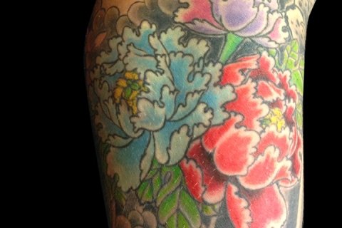 Floral tattoos - Sacred Rose artists are experts at tattooing florals! From photo realism, to traditional to fine line and black and grey, there is a style and an artist that fits your needs