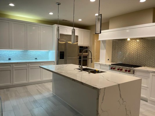 Kitchen Remodel - Santa Clarita - This remodel was the first step in a complete interior remodel. The kitchen started as the original solid oak cabinetry with granite countertops...as a lot of other kitchens do. In this project we completely gutted and renovated the kitchen area making it a bigger and open concept kitchen.
This job included:
- Complete demolition of original kitchen.
- New prefabricated and custom cabinetry (white shaker)
- New quartz countertops
- Rerouting plumbing points to accomodate for new wall oven, and fridge and stove relocation.
- Flooring
- Electrical work
- Paint Kitchen Remodel - Santa Clarita - This remodel was the first step in a complete interior remodel. The kitchen started as the original solid oak cabinetry with granite countertops...as a lot of other kitchens do. In this project we completely gutted and renovated the kitchen area making it a bigger and open concept kitchen.
This job included:
- Complete demolition of original kitchen.
- New prefabricated and custom cabinetry (white shaker)
- New quartz countertops
- Rerouting plumbing points to accomodate for new wall oven, and fridge and stove relocation.
- Flooring
- Electrical work
- Paint