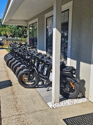 Check out our E-Bikes - Explore Gulf State Park the easy and fun way with up to 5 hours of ride time—plenty of time to discover all 28 miles of the park's beautiful paved backcountry trails.

Choose Your Ride:
• Step-Thru Ebikes – $50 (easy-to-ride design, perfect for most riders)
• Adult Fat Tire Electric Trikes – $70 (extra stability and comfort)
• Passenger Kid Carrier Ebikes – $100 (great for family adventures)

Customize Your Adventure:
Upgrade with premium cushioned seats ($5), pull-behind trailers ($25), or add a phone holder and Bluetooth speaker for just $5 each.

Ride Straight Into Nature—No Streets Required
Our shop is located directly beside Gulf State Park, so you can start riding immediately without dealing with busy Gulf Shores traffic, crowded sidewalks, or street crossings.

Everything You Need Is Included
Every rental comes with a helmet, trail map, and insulated cooler bag, making it easy to pack drinks, snacks, or lunch for your ride.

Experience the Park's Most Scenic Trails
Pedal beneath the towering, moss-draped live oaks of Gulf Oak Ridge Trail or cruise through the beautiful Rosemary Dunes Trail, where riders often spot local wildlife—including "Lefty," the park's famous resident alligator.

Whether you're looking for a relaxing nature ride, a family outing, or a memorable way to explore the park, our electric bikes and trikes make it easy, comfortable, and fun.