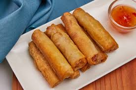 Lumpiang Shanghai - Filipino spring roll filled with seasoned ground pork and vegetables, wrapped in a thin pastry and deep-fried until crispy, Lumpiang Shanghai - Filipino spring roll filled with seasoned ground pork and vegetables, wrapped in a thin pastry and deep-fried until crispy,