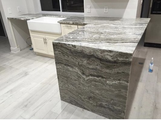 Fantasy Brown- Custom kitchen Countertops - Fantasy Brown has smooth, diagonal lines of translucent gray and white with swirls of faint pastels, making it a great choice for homeowners who want the look of marble but the durability of quartzite. Fantasy Brown slabs can vary in color and pattern from batch to batch.
With proper sealing once to twice a year, you won't have to worry about etching or staining. Fantasy Brown- Custom kitchen Countertops - Fantasy Brown has smooth, diagonal lines of translucent gray and white with swirls of faint pastels, making it a great choice for homeowners who want the look of marble but the durability of quartzite. Fantasy Brown slabs can vary in color and pattern from batch to batch.
With proper sealing once to twice a year, you won't have to worry about etching or staining.