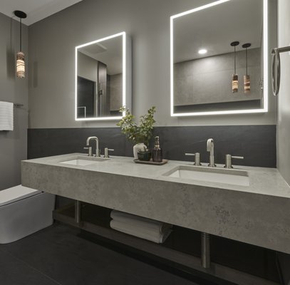 Ultramodern Master Bathroom - In their Master Suite, the client looked for a complete gut renovation of their bathroom space. We decided to remove a partition wall separating an old jacuzzi style bathtub, and the shower, completely opening up the space. The client's ultimate goal for the space was to create an ultra Zen, spa-like space to relax in after a day of travels. Our focus was to keep the space as clean and minimal as possible, letting the materials and fixtures do all the talking.