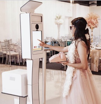 Glam Booth - Our Glam Booth’s sleek and modern design is sure to keep your guests engaged in laughter and fun! Glam Booth - Our Glam Booth’s sleek and modern design is sure to keep your guests engaged in laughter and fun!