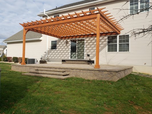 Raised paver patio with pergola - This is a raised patio with a pergola and steps down to yard. Raised paver patio with pergola - This is a raised patio with a pergola and steps down to yard.