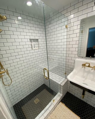 Retro bathroom - Love the subway tile shower with Gold accent ￼