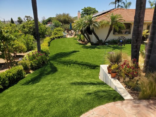 Never Mow*Water Again-Perfect Landscaping - This is a beautiful estate in Poway that the owner wanted to replace his existing thirsty and labor hungry lawn with our premium turf.  There were some challenges with the shapes and elevation changes, but our guys are truly experts when it comes to installation of artificial lawns.  The pool looks great in contrast to the turf as does the existing hardscape.