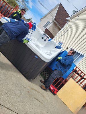 Onsite Hot Tub Relocation - Our Customer ordered a Hot Tub from an Online Vendor. The Shipping Company would not place the Hot Tub on the Deck, they only offer Driveway delivery. The Customer hired us to place the Hot Tub on the Deck where he wanted it. Onsite Hot Tub Relocation - Our Customer ordered a Hot Tub from an Online Vendor. The Shipping Company would not place the Hot Tub on the Deck, they only offer Driveway delivery. The Customer hired us to place the Hot Tub on the Deck where he wanted it.