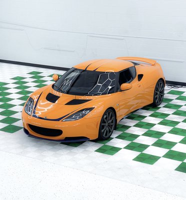 Lotus Evora: Custom 2 Tone Vinyl Wrap - This client was looking for a custom 2 tone vinyl wrap. After some consultation, we reached a design he loved. From there, our team got to work and came up with this beautiful custom bright orange and midnight blue wrap. All the blue you see on this vehicle was custom cut to fit the clients' liking. Vinyl wrapping like this is our bread and butter. If you can imagine it, we can wrap it! Lotus Evora: Custom 2 Tone Vinyl Wrap - This client was looking for a custom 2 tone vinyl wrap. After some consultation, we reached a design he loved. From there, our team got to work and came up with this beautiful custom bright orange and midnight blue wrap. All the blue you see on this vehicle was custom cut to fit the clients' liking. Vinyl wrapping like this is our bread and butter. If you can imagine it, we can wrap it!