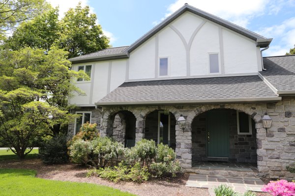 Stonebridge Porch & Exterior Refresh - A charming stone-accented home exterior featuring a welcoming front porch, landscaped entry walkway, and comfortable outdoor living areas. The property combines rustic stonework with modern outdoor spaces, including a screened porch and backyard patio designed for relaxation and entertaining. The project highlights curb appeal, inviting entry points, and functional outdoor living. Stonebridge Porch & Exterior Refresh - A charming stone-accented home exterior featuring a welcoming front porch, landscaped entry walkway, and comfortable outdoor living areas. The property combines rustic stonework with modern outdoor spaces, including a screened porch and backyard patio designed for relaxation and entertaining. The project highlights curb appeal, inviting entry points, and functional outdoor living.