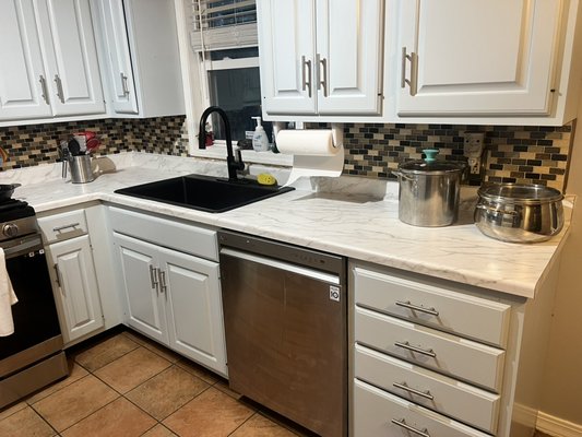 Kitchen countertops - These countertops were installed in place of an early 200’s laminate to give the space a more modern feel Kitchen countertops - These countertops were installed in place of an early 200’s laminate to give the space a more modern feel