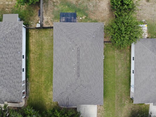 Hutto Shingle Roof Replacement — Before & After - Barnes N' Roofs completed an architectural shingle roof replacement in Hutto, Texas. Nine photographs document the original shingles and roof vents at roof level, followed by aerial views of the finished roof from several angles. This residential roofing project provides a direct before-and-after comparison for Hutto homeowners considering a shingle roof replacement. Hutto Shingle Roof Replacement — Before & After - Barnes N' Roofs completed an architectural shingle roof replacement in Hutto, Texas. Nine photographs document the original shingles and roof vents at roof level, followed by aerial views of the finished roof from several angles. This residential roofing project provides a direct before-and-after comparison for Hutto homeowners considering a shingle roof replacement.