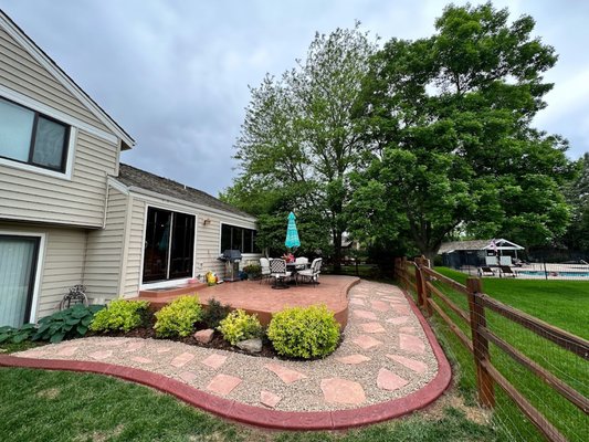 Colored Concrete Patio and Flagstone Path - Here is a great area to relax with the family in the backyard! Customer had issues with dogs ruining the grass where there is now a flagstone and river rock path. The dogs now have their very own runway and the dogs now don't muddy the house as much... Plus it looks great! Colored Concrete Patio and Flagstone Path - Here is a great area to relax with the family in the backyard! Customer had issues with dogs ruining the grass where there is now a flagstone and river rock path. The dogs now have their very own runway and the dogs now don't muddy the house as much... Plus it looks great!