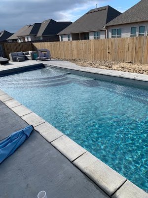 Automatic Cover Pool - This fiberglass pool was installed with a automatic safety cover and custom coping. Automatic Cover Pool - This fiberglass pool was installed with a automatic safety cover and custom coping.