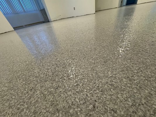 Condo Floors - This was a one-day project completed after a first-floor condominium was impacted by a hurricane. The new waterproof polyaspartic coatings flooring comes with a lifetime warranty.