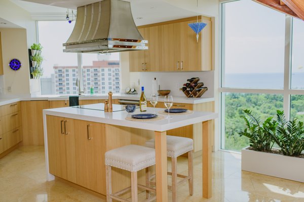 Oceanside Gem Kitchen Remodel - This lovely Ft. Lauderdale kitchen echoes the hues of the beach below. The natural tones and texture of the cabinetry provide a light and airy feel and are the perfect compliment to the stunning views which surround the space. The vibrancy of the semi precious stones in various shades of blue are an elegant touch, which nicely mimic the reflection of light from the ocean. Oceanside Gem Kitchen Remodel - This lovely Ft. Lauderdale kitchen echoes the hues of the beach below. The natural tones and texture of the cabinetry provide a light and airy feel and are the perfect compliment to the stunning views which surround the space. The vibrancy of the semi precious stones in various shades of blue are an elegant touch, which nicely mimic the reflection of light from the ocean.