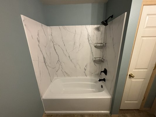 Installing a Bathtub Surround - This project unfolded as a homeowner's special! Embracing their ambitious spirit, the homeowners embarked on the journey themselves. Midway, recognizing the challenge, they wisely invited us to step in and bring our expertise to complete the tub surround installation. Turning their vision into a beautifully finished project. Installing a Bathtub Surround - This project unfolded as a homeowner's special! Embracing their ambitious spirit, the homeowners embarked on the journey themselves. Midway, recognizing the challenge, they wisely invited us to step in and bring our expertise to complete the tub surround installation. Turning their vision into a beautifully finished project.