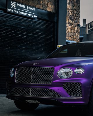 Purple Satin Perfection Bentley Bentayga Full Vinyl Wrap - Command the road with elegance and bold style, courtesy of our satin purple wrap transformation for this Bentley Bentayga. At White Swan Auto Spa in Brooklyn, we turned luxury into art by meticulously wrapping every panel with premium-grade vinyl for a flawless, matte satin finish.
This wasn't just a color update; it was a statement. From the seamless craftsmanship to the added paint protection film on high-impact areas like the hood and front bumper, every detail was designed to elevate both appearance and durability.
The result? A vibrant, head-turning masterpiece that combines opulence with purpose.
Searching for the ultimate luxury vinyl wrap service in NYC? Experience true automotive artistry with White Swan Auto Spa. Book your consultation today. Purple Satin Perfection Bentley Bentayga Full Vinyl Wrap - Command the road with elegance and bold style, courtesy of our satin purple wrap transformation for this Bentley Bentayga. At White Swan Auto Spa in Brooklyn, we turned luxury into art by meticulously wrapping every panel with premium-grade vinyl for a flawless, matte satin finish.
This wasn't just a color update; it was a statement. From the seamless craftsmanship to the added paint protection film on high-impact areas like the hood and front bumper, every detail was designed to elevate both appearance and durability.
The result? A vibrant, head-turning masterpiece that combines opulence with purpose.
Searching for the ultimate luxury vinyl wrap service in NYC? Experience true automotive artistry with White Swan Auto Spa. Book your consultation today.