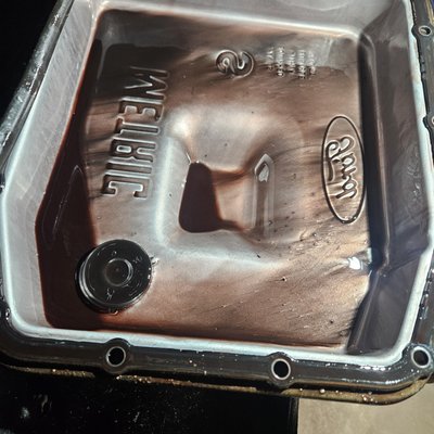 2005 Ford F150 - This picture is the view of the transmission pan before rebuild and clutch condition after disassembly