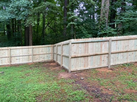 Nail Up Fences in Kennesaw - Privacy Fence For Your YardThe classic “nail up” fence is simple and sturdy. This fence normally consists of non-overlapping, side-by-side boards, but board-on-board styles are also possible. Typically, this style will use “dog-eared” boards or regular flat top boards. It’s a great way to add privacy to your yard, and this style will typically be more affordable than others.
