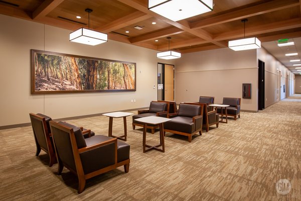City of Lake Forest Civic Center - G|M Business Interiors partnered with the City of Lake Forest and Carrier Johnson+Culture to provide the community with a brand new civic center which is referred to as the community's "100 year home". Spanning across 12.5 acres, the civic center is comprised of 4 buildings; a multipurpose community center, a senior center, a city council chamber/ Performing Arts venue, and a city hall/administration offices building.
The 21,000 sf. community center includes conference rooms, events rooms, and a catering kitchen. The 17,500 sf. single story senior center offers computer training rooms, space for arts & crafts, wellness rooms, and a game room. The 13,600 sf. city council chambers are housed in a two story building along with the 200 seat Performing Arts venue. Lastly, the 49,900 city hall and administration office building shares space with the community policy center. City of Lake Forest Civic Center - G|M Business Interiors partnered with the City of Lake Forest and Carrier Johnson+Culture to provide the community with a brand new civic center which is referred to as the community's "100 year home". Spanning across 12.5 acres, the civic center is comprised of 4 buildings; a multipurpose community center, a senior center, a city council chamber/ Performing Arts venue, and a city hall/administration offices building.
The 21,000 sf. community center includes conference rooms, events rooms, and a catering kitchen. The 17,500 sf. single story senior center offers computer training rooms, space for arts & crafts, wellness rooms, and a game room. The 13,600 sf. city council chambers are housed in a two story building along with the 200 seat Performing Arts venue. Lastly, the 49,900 city hall and administration office building shares space with the community policy center.