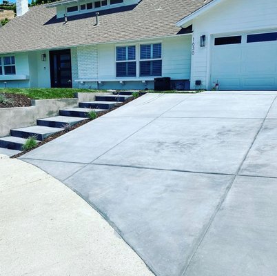 Renovation, concrete driveway and retaining wall installation - This was a complete renovation of the front yard. Client wanted a concrete wall reinforced with rebar and mesh along with walkway and lighting. While project was on the go we ended up getting a change order for a drip conversion and new plant installation. Our client was happy with the work and gave us another extension for a complete new drive way Renovation, concrete driveway and retaining wall installation - This was a complete renovation of the front yard. Client wanted a concrete wall reinforced with rebar and mesh along with walkway and lighting. While project was on the go we ended up getting a change order for a drip conversion and new plant installation. Our client was happy with the work and gave us another extension for a complete new drive way