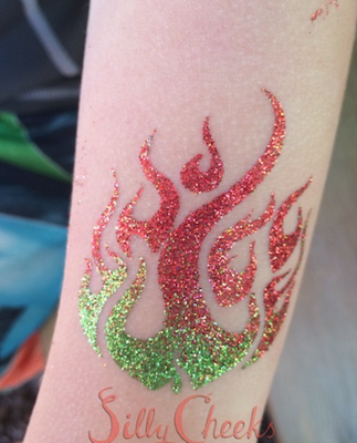 Glitter Tattoos - Glitter Tattoos are very popular amongst kids, teenagers and adults. They are waterproof and great for pool parties or any events that could use some sparkle. Glitter tattoos are 100% hypoallergenic and made specifically for the skin. We use cosmetic grade polyester glitter and waterproof, hypoallergenic body art glue. With over 100 designs to choose from, you will be sure to find your favorite tattoo! Glitter Tattoos - Glitter Tattoos are very popular amongst kids, teenagers and adults. They are waterproof and great for pool parties or any events that could use some sparkle. Glitter tattoos are 100% hypoallergenic and made specifically for the skin. We use cosmetic grade polyester glitter and waterproof, hypoallergenic body art glue. With over 100 designs to choose from, you will be sure to find your favorite tattoo!